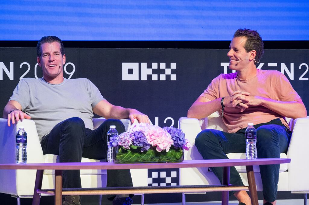 Cameron Winklevoss, co-founder and president of Gemini Trust Co, centre, with his brother Tyler Winklevoss, co-founder and chief executive officer, during the Token2049 conference in Singapore. Photograph: Joseph Nair/Bloomberg