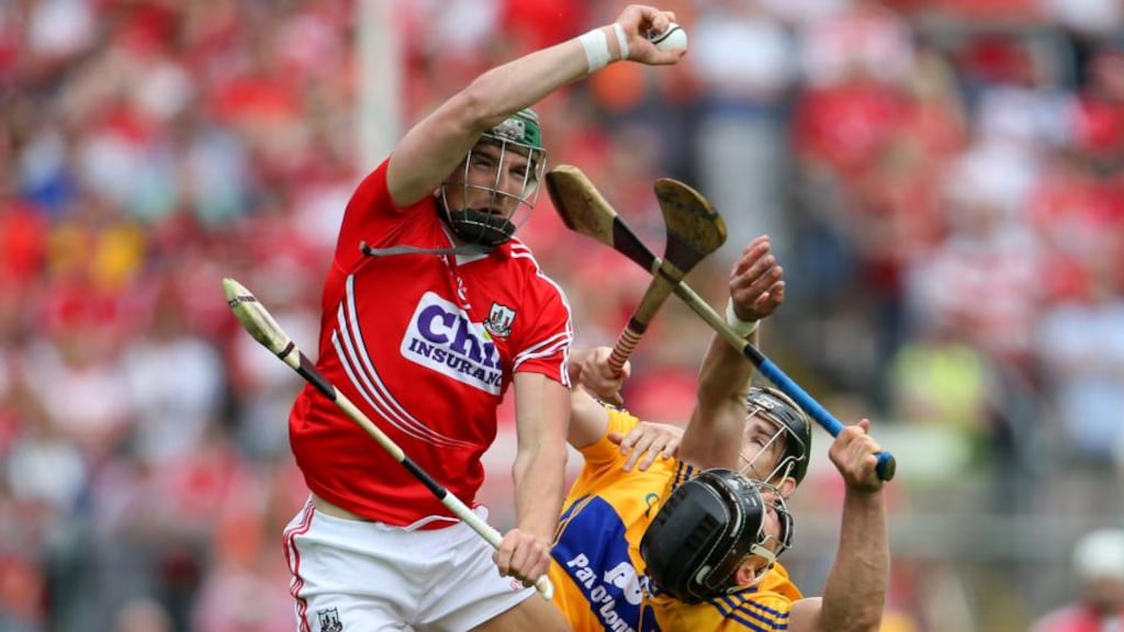 Cork’s Aidan Walsh climbs above the Clare duo of Pat Donnellan and John Conlon to catch the sliotar during the Munster SHC semi-final at Semple Stadium. Photograph: Cathal Noonan/Inpho