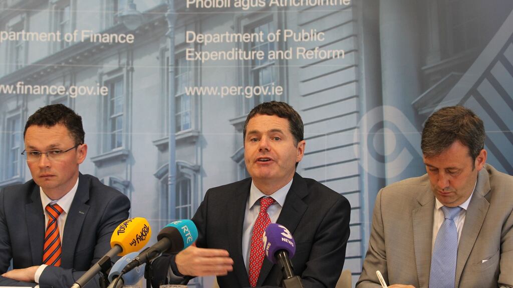 Minister of State for Public Procurement Patrick O Donovan, the Minister of Finance Paschal Donohoe, and Minister of State for Financial Services and Insurance Michael Darcy at the launch of the Summer Economic Statement on Wednesday. Photograph: Stephen Collins/Collins Photos