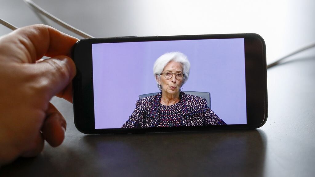 Christine Lagarde, president of the European Central Bank (ECB), is displayed on a smartphone during a live stream video of the central bank’s virtual rate decision news conference in Frankfurt, Germany. Photographer: Alex Kraus/Bloomberg