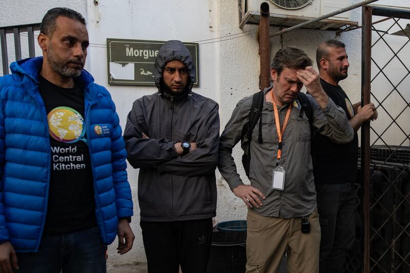 World Central Kitchen workers gather around the bodies of their colleagues after they were transferred to Al-Najjar Hospital in Rafah, southern Gaza Strip, Photograph: Haitham Imad/EPA-EFE