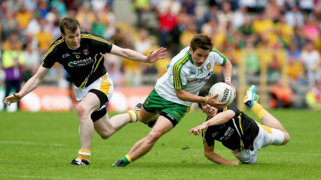 Darrach O’Connor of Donegal gets away from Antrim’s Kevin Boyle and Justin Crozier at Clones yesterday. Photograph: Donall Farmer/Inpho
