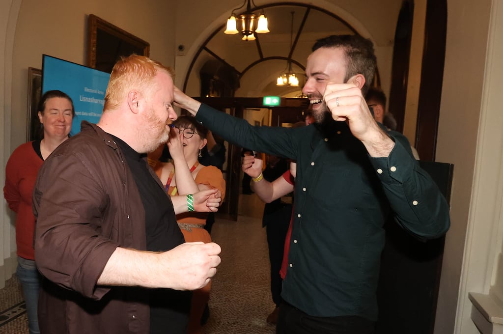 Brian Smyth of the Green Party (left), who has retained his seat at Belfast City Hall. Photograph: Liam McBurney/PA