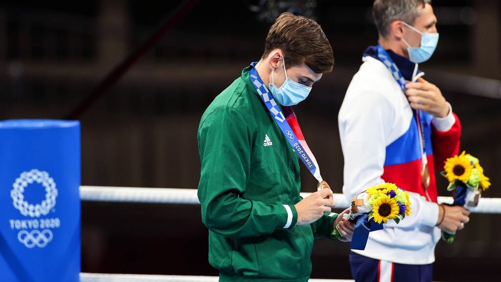 Aidan Walsh is presented with his bronze medal. Photo: James Crombie/Inpho