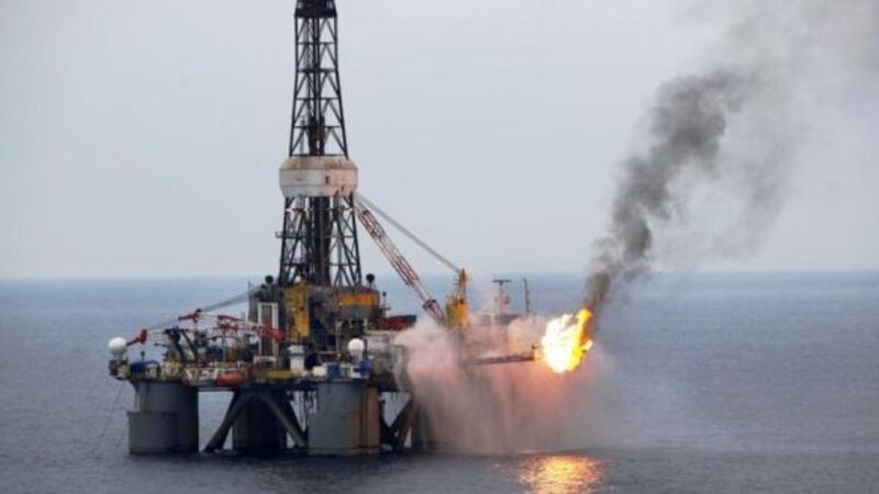 Oil up after US crude stocks drop, still close to multi-year lows