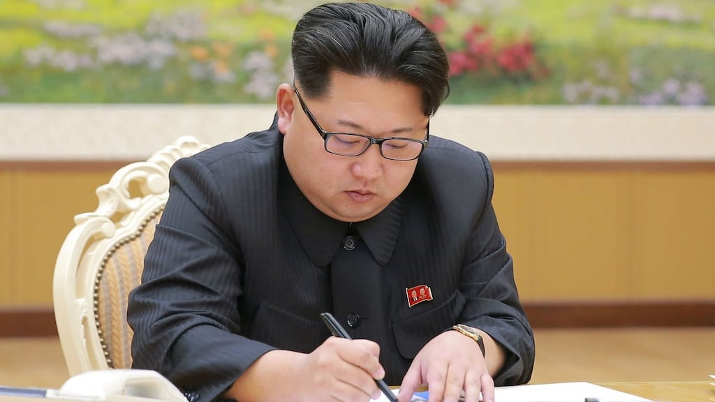 Photograph released by North Korea’s official Korean Central News Agency (KCNA) shows Kim Jong-Un signing a document for a hydrogen bomb test in Pyongyang. Photograph: AFP/Getty Images