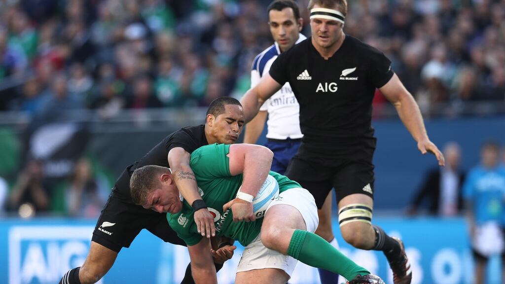 Tadhg Furlong is tackled by Aaron Smith of New Zealand during the match at Soldier Field in Chicago. Photograph: Phil Walter/Getty Images
