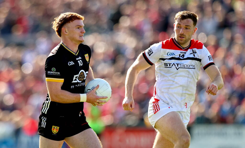 Down’s Danny Magill and Louth's Sam Mulroy. Photograph: Ryan Byrne/Inpho