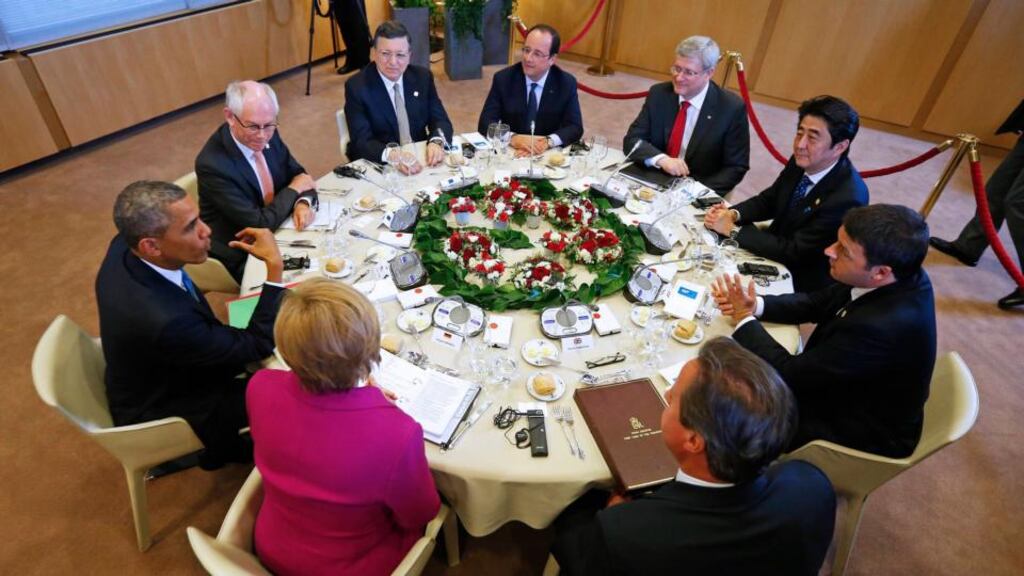 From left: US president Barack Obama, European Council president Herman Van Rompuy, European Commission president José Manuel Barroso, French president François Hollande, Canada’s prime minister Stephen Harper, Japan’s prime minister Shinzo Abe, Italy’s prime minister Matteo Renzi, Britain’s prime minister David Cameron and Germany’s chancellor Angela Merkel at the meeting in Brussels. Photograph: Yves Herman/Reuters