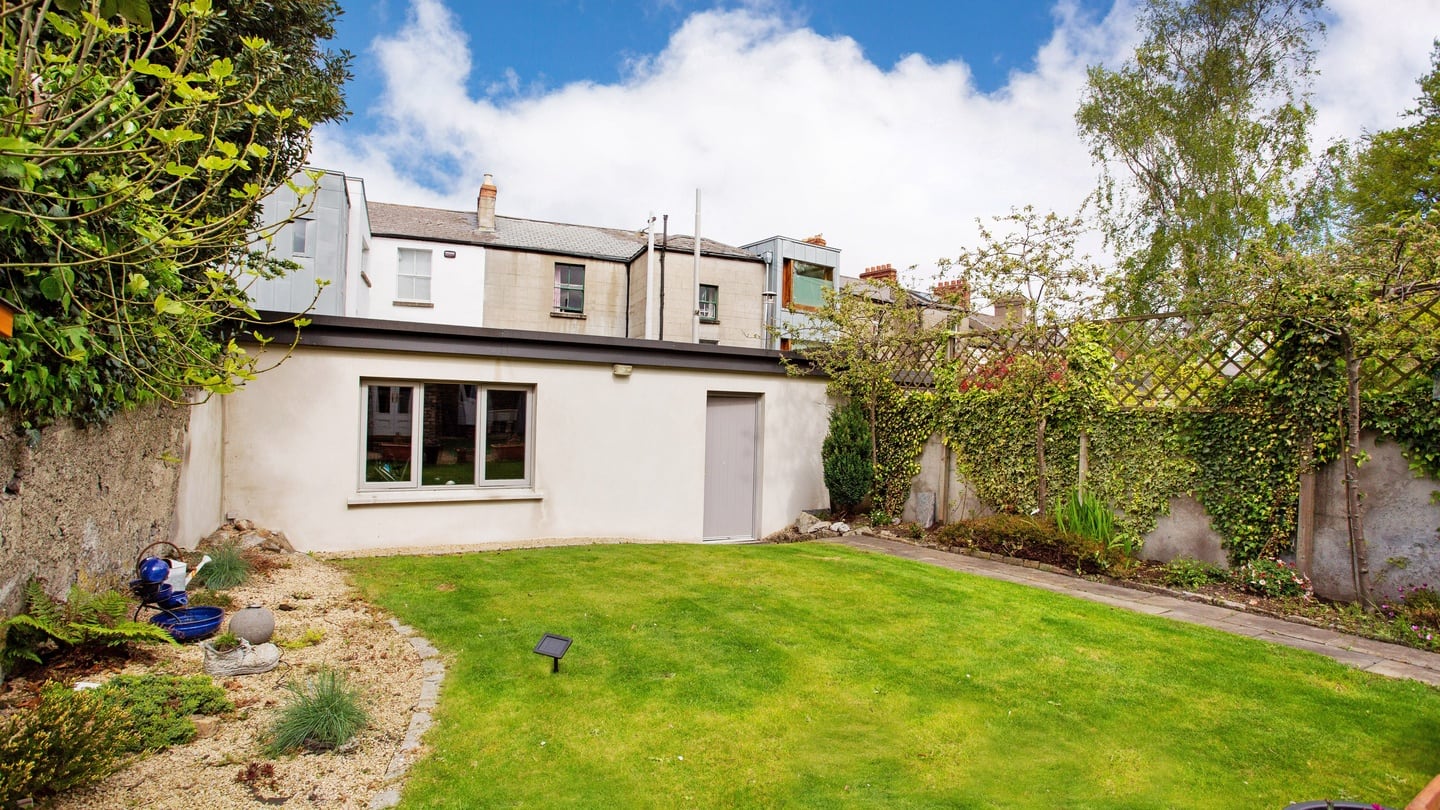 At the end of the unfussy garden is a large block-built garage that is currently used as a gym