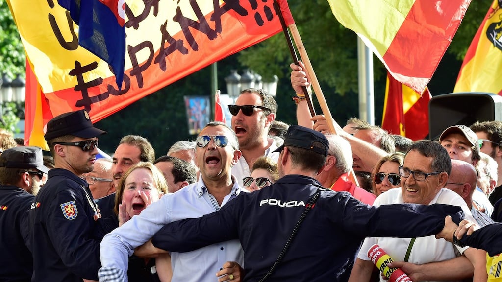 Policemen block far-right demonstrators protesting in front of Madrid City Hall against the presence of president of the Catalan government Carles Puigdemont. Photograph: Gerard Julien/AFP/Getty