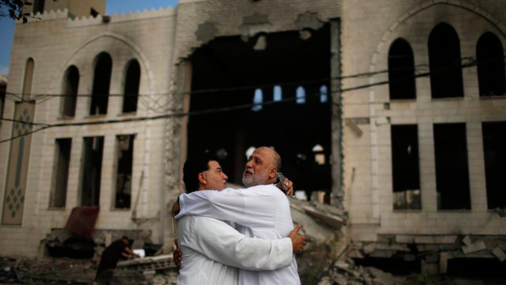 Palestinians reacts in front of a mosque which witnesses said was hit in an Israeli air strike, in Gaza City. Israeli Prime Minister Benjamin Netanyahu has said his country needs to be prepared for a long conflict in the Palestinian enclave, squashing any hopes of a swift end to 22 days of fighting. Photograph: Suhaib Salem/Reuters