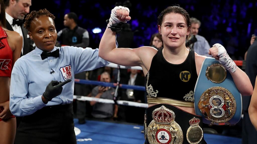 Katie Taylor celebrates her win over Victoria Bustos after their WBA & IBF world lightweight title unification bout in New York City. Photograph: Elsa/Getty Images