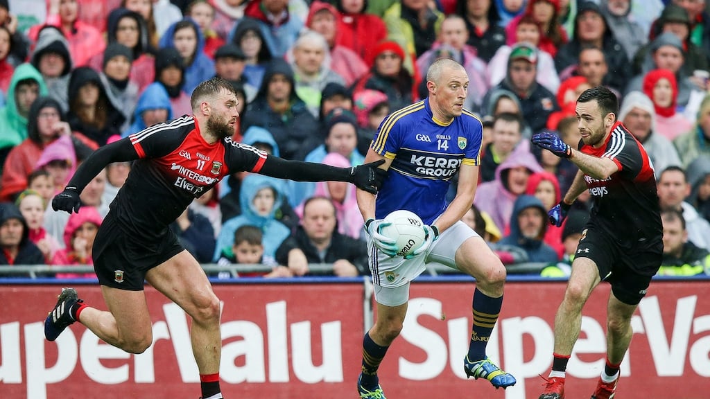 Mayo’s Aidan O’Shea and Kevin McLoughlin attempt to dispossess Kerry’s  Kieran Donaghy. Photograph: Inpho/Gary Carr