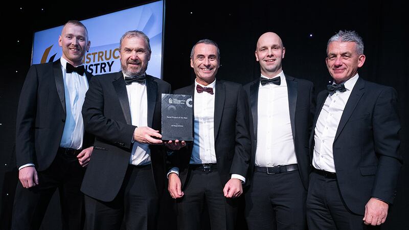Neil Wall, head of Entries, BusinessRiver, presents the Retail Project of the Year award to the SDS Design Engineers and Lawler Consulting team.