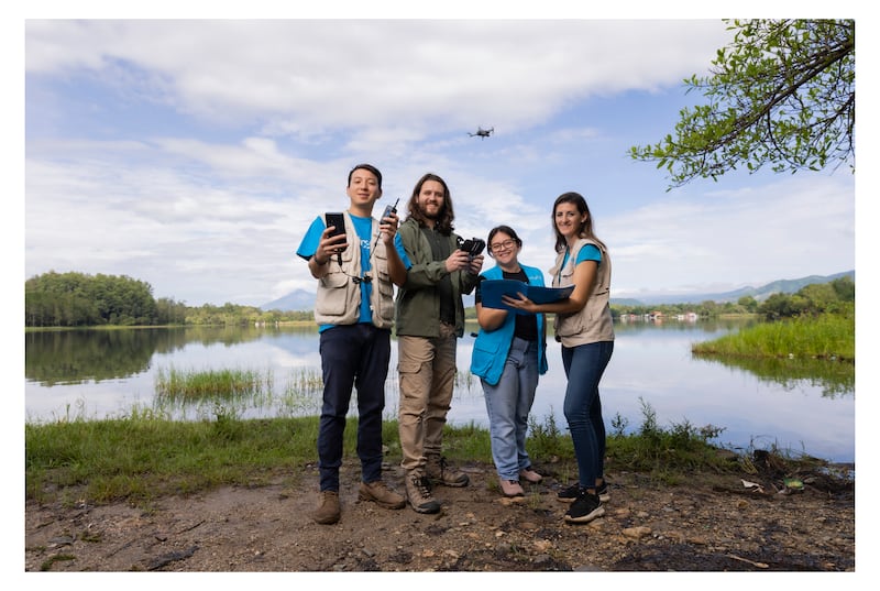 UNICEF Guatemala team members and Aerobots in Guatemala drone engineer Dan Alvarez of the UNICEF-led Dronebots project are pictured at Laguna El Pino near Guatemala City. © UNICEF/UNI450941/Quintero