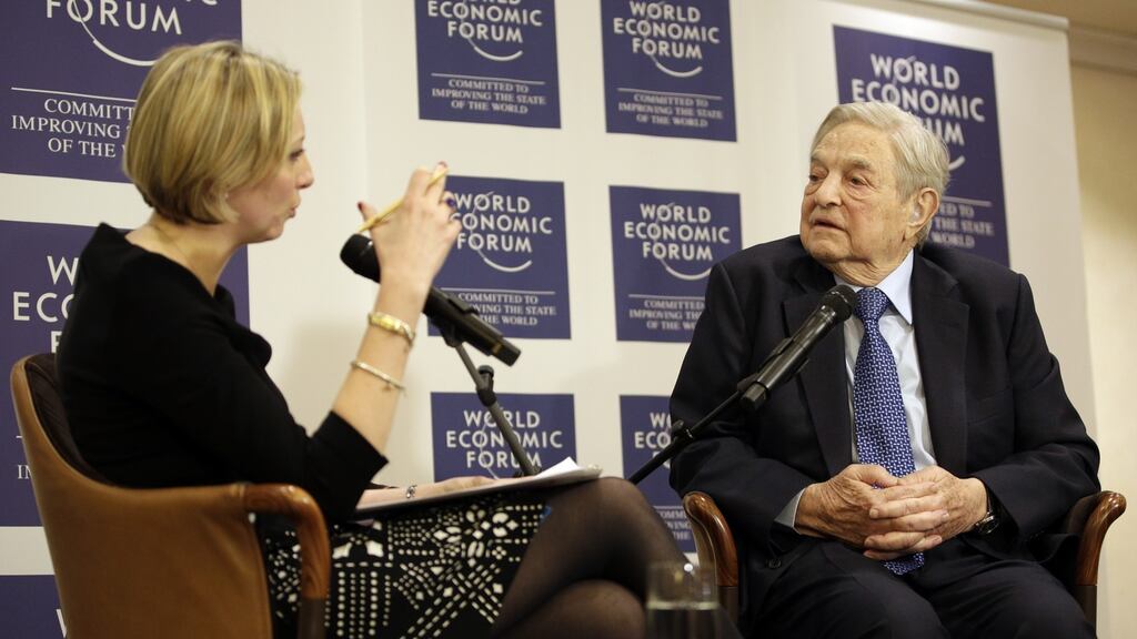 Francine Lacqua, editor at large and anchor for Bloomberg Television, left, speaks with George Soros, billionaire and founder of Soros Fund Management LLC, during an interview at the World Economic Forum (WEF) in Davos, Switzerland . Photographer: Matthew Lloyd/Bloomberg
