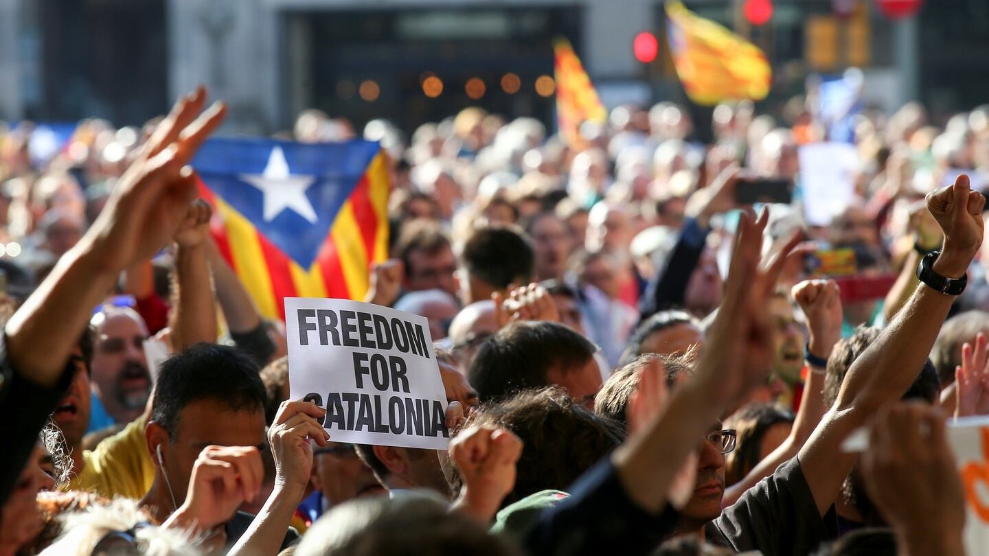 A crowd of protesters gather outside the Catalan region’s economy ministry after junior economy minister Josep Maria Jove was arrested by Spanish police. Photograph: Albert Gea/Reuters