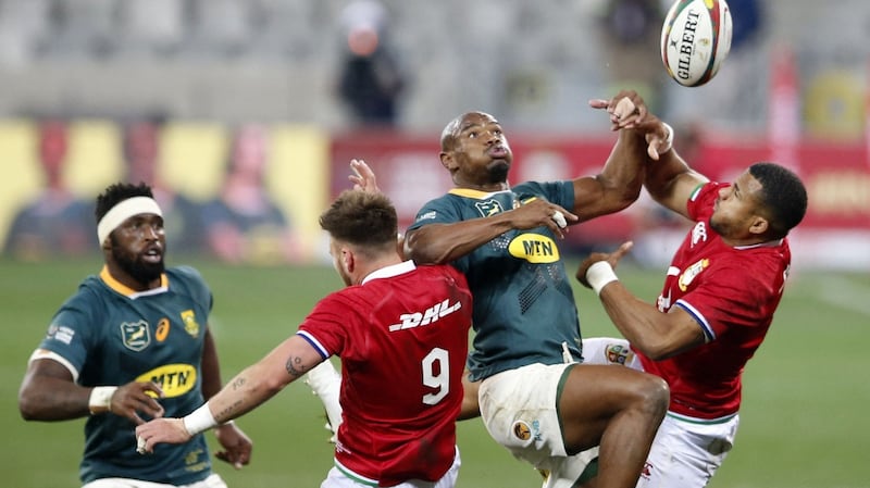 South Africa’s left wing Makazole Mapimpi challenges with Ali Price and Anthony Watson. Photograph: Phil Magakoe/Getty/AFP