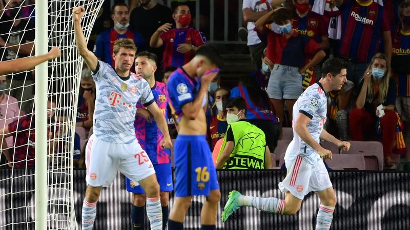 Bayern Munich forward Robert Lewandowski celebrates scoring a goal during the Champions League game against Barcelona at the Nou Camp. Photograph: Lluis Gene/AFP via Getty Images