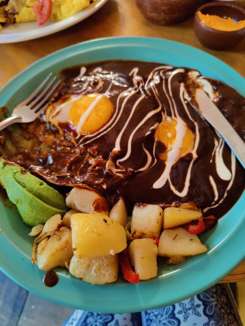 Mole chilaquiles, or eggs and avocado with chocolate sauce, in Mexico. Photograph: Fiadh Ní Dhonnchadha and Cónán Ó Broin