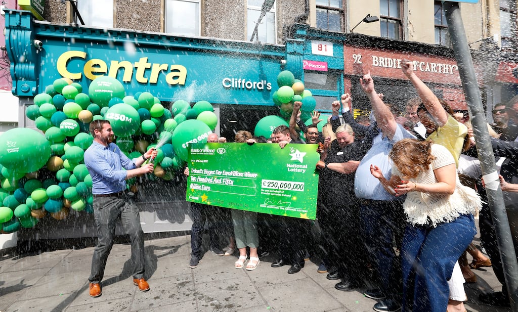 Shandon Street Centra store manager Simon Champ celebrating with staff from Clifford's Centra in Cork City centre. Photograph: Mac Innes Photography/National Lottery/PA Wire