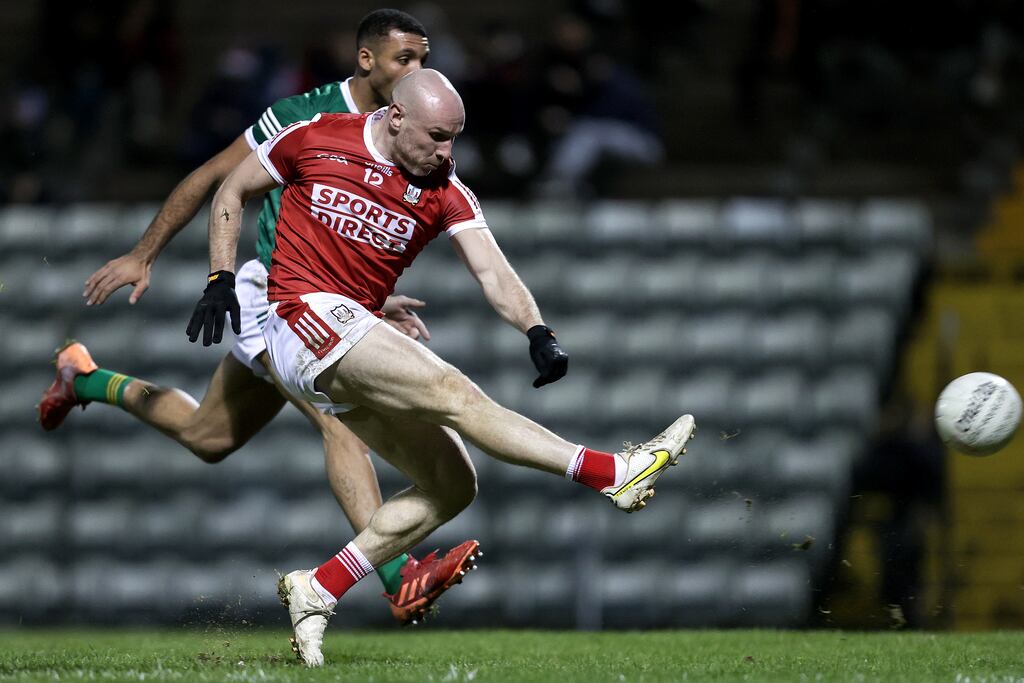 Cork's Brian O’Driscoll scores his side’s fourth goal despite the efforts of Stefan Okunbor of Kerry. Photograph: Laszlo Geczo/Inpho
