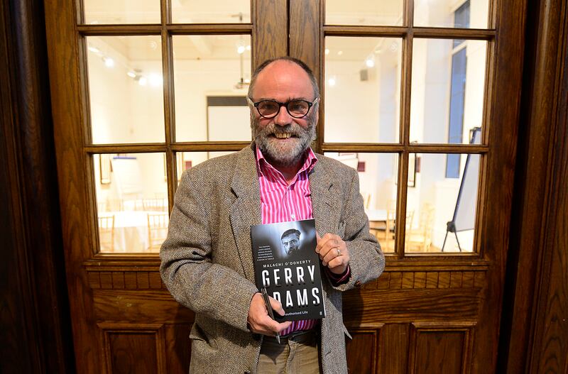 Malachi O'Doherty with his book Gerry Adams: An Unauthorised Life in 2017. Photograph: Arthur Allison/Pacemaker Press