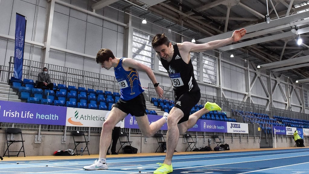 Mark English dips for the line to win the Men’s 800m ahead of Cian McPhillips during day one of the Irish Life Health Elite Athlete Indoor Micro Meet at Sport Ireland National Indoor Arena. Photograph: Sam Barnes/Sportsfile