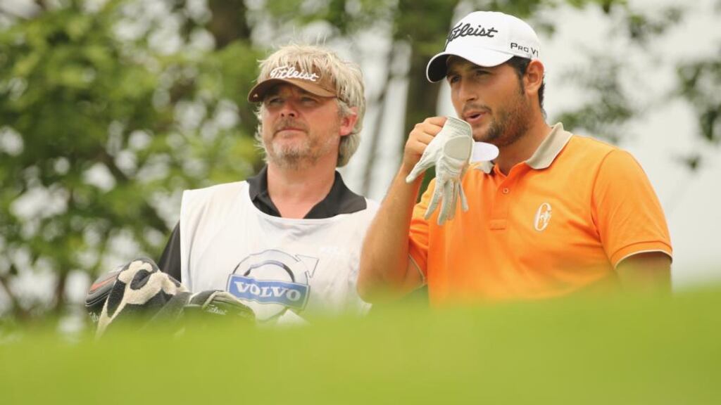 Alexander Levy of France talks to his caddie during the second round of the 2014 Volvo China Open at Genzon Golf Club. Photograph: Ian Walton/Getty Images