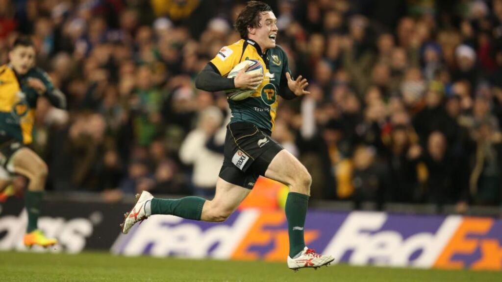 Northampton Saints winger  Jamie Elliott hares away for a breakaway try at the death in the Heineken Cup Pool One game at the Aviva Stadium. Photograph: Billy Stickland/Inpho