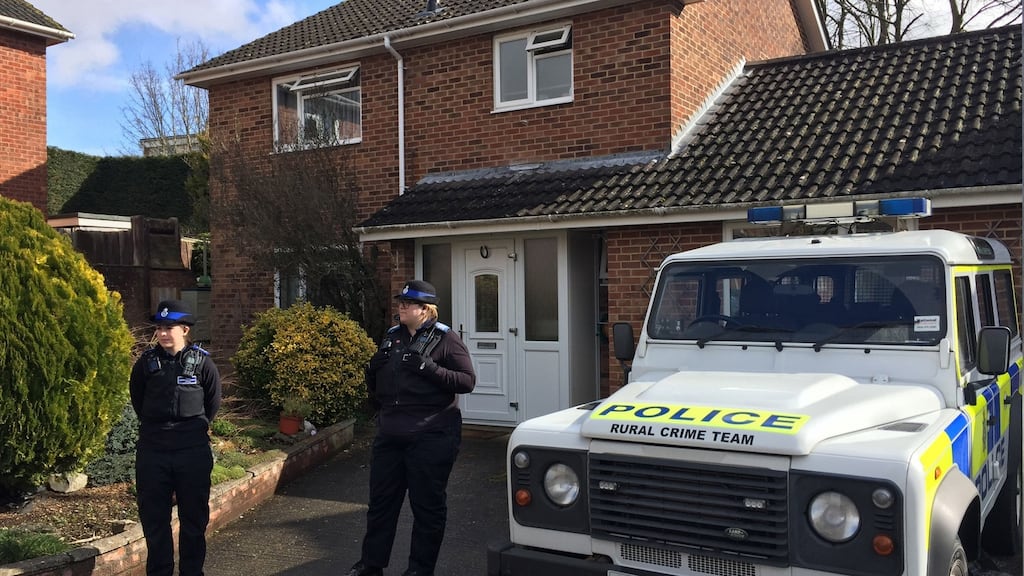 Police officers stand outside the Salisbury home of former Russian double agent Sergei Skripal, after he and and a woman in her 30s were found slumped on a bench in Salisbury on Sunday. Photograph: Ben Mitchell/PA Wire