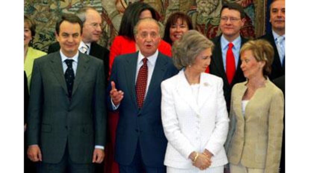 Spanish King Juan Carlos (centre) gestures beside the Prime Minister , Mr Jose Luis Rodrigues Zapatero (left) as Queen Sofia talks to new Spanish First Deputy Prime Minister, Ms Maria Teresa Fernandez de la Vega (right) after the Cabinet swearing-in ceremony.