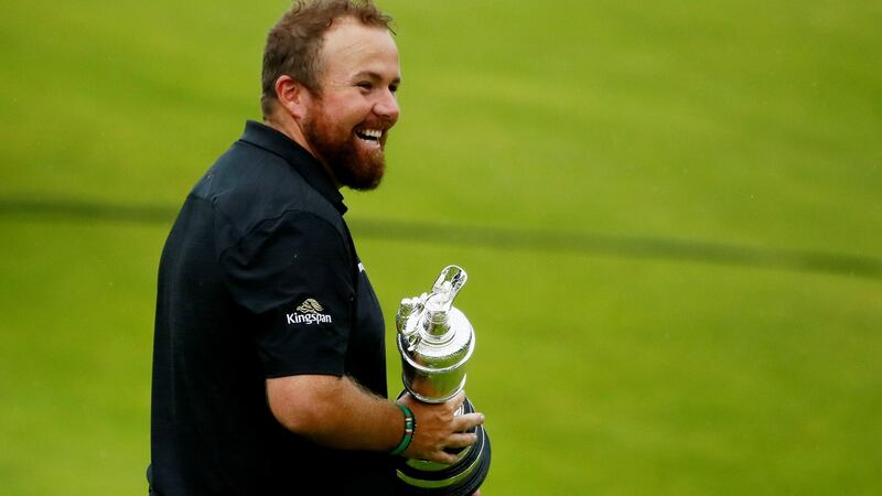 Shane Lowry celebrates with the Claret Jug. Photograph: Jason Cairnduff/Reuters
