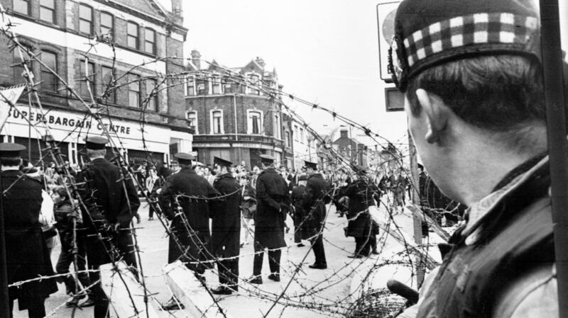 A Scottish soldier watches a loyalist parade in Belfast in 1970. Photograph: AFP/Getty Images