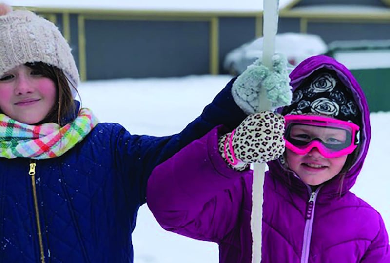 Texas snow: Grace and Lydia Curran enjoy the unseasonal weather