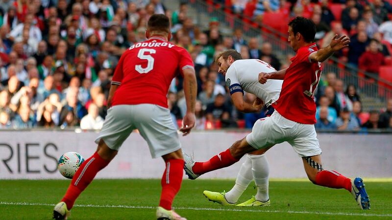 Harry Kane scores the opening goal. Photograph: Getty Images