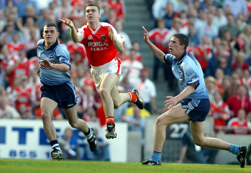 Oisín McConville fists over Armagh's winning point to overcome Dublin in the 2002 All-Ireland Senior Football Championship semi-final. Photograph: Tom Honan/Inpho