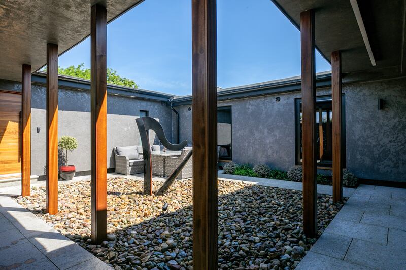 Harp sculpture in courtyard