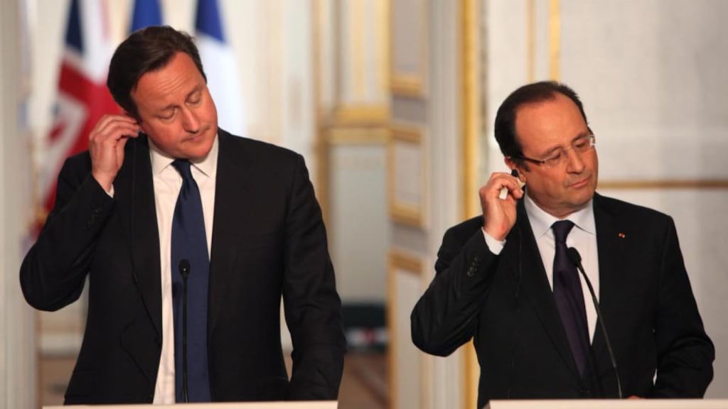 British Prime Minister David Cameron and French President Francois Hollande, adjust their earpieces during a press conference at the Elysee Palace in Paris. Photograph: Thibault Camus/AP