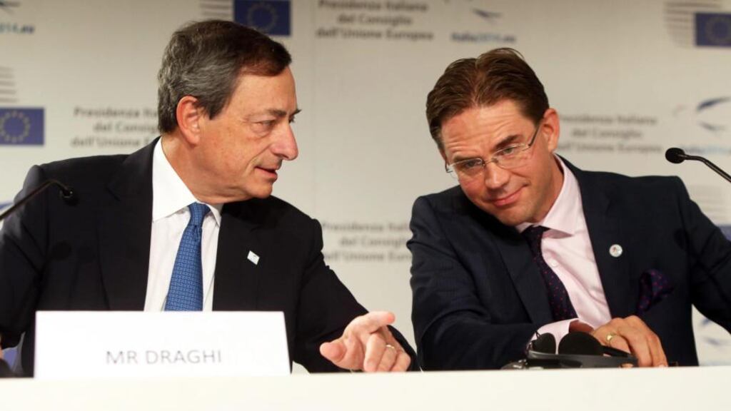 European Central Bank president Mario Draghi (left) and Finnish outgoing prime minister Jyrki Katainen at  a press conference at the euro-group finance ministers’ meeting in Milan yesterday.  Photograph: EPA/Matteo Bazzi