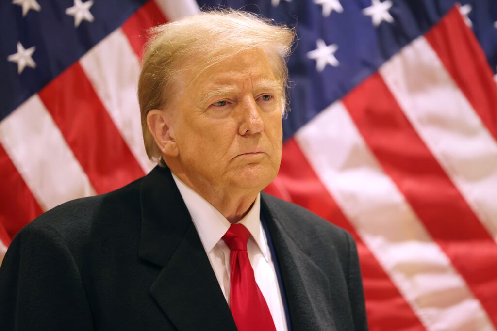 Former US president Donald Trump listens as his lawyer Todd Blanche speaks during a press conference after a pretrial hearing in New York City on Monday. Photograph: Michael M Santiago/Getty Images