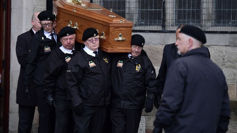 Billy McKee’s coffin is  carried during his  funeral procession  in Belfast. Photograph: Charles McQuillan/Getty Images