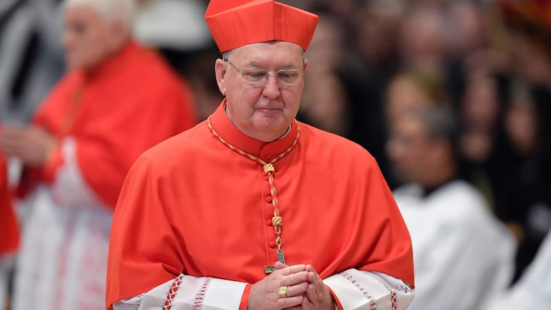 Bishop of Dallas Kevin Joseph Farrell walks after kneeling before Pope Francis to pledge allegiance and become cardinal, on Saturday in Rome. Photograph: AFP/Getty Images