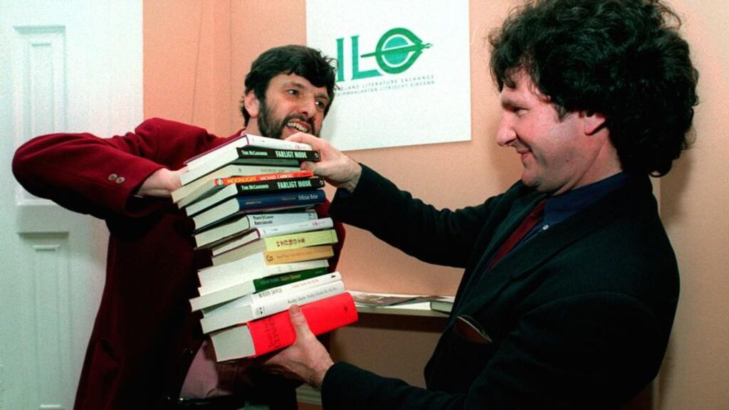 Micheal O’Siadhail, left, the first chairman of Ireland Literature Exchange, presents a selection of books by well-known Irish writers which have been translated into foreign languages, to Prof Ciaran Benson, then chairman of the Arts Council, who launched Ireland Literature Exchange in Dublin in 1994. Photograph; Paddy Whelan
