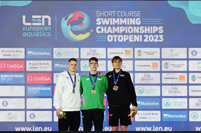 Silver medal Lithuania's Danas Rapsys (L), gold medal Ireland's Daniel Wiffen on the podium with Lithuania's Danas Rapsys (left) and Belgium's Lucas Henveaux (right). Photograph: Daniel Mihailescu/AFP via Getty Images