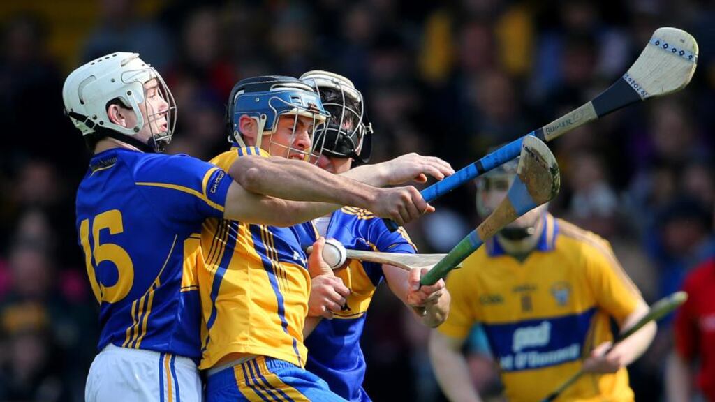 Clare’s Brendan Bugler under pressure from Niall O’Meara and Patrick Maher of Tipperary at the Gaelic Grounds last week. Photo: Cathal Noonan/Inpho