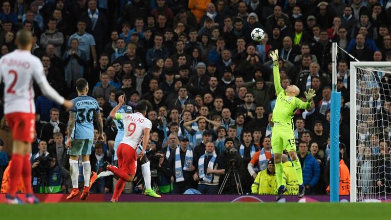 Radamel Falcao chips the ball over Manchester City goalkeeper Willy Cabellero to score his second and his side’s third goal during the Uefa Champions League round of 16 first-leg match at Etihad Stadium. Photograph: Stu Forster/Getty Images