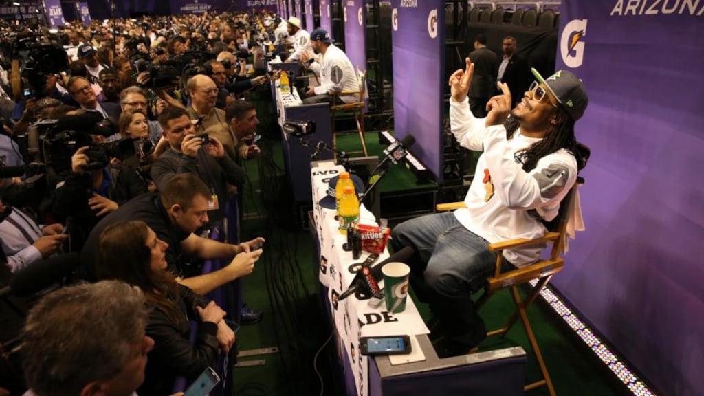 Seattle Seahawks running back Marshawn Lynch attending a pre-Super Bowl media appearance so he wouldn’t get fined. (Doug Mills/The New York Times)