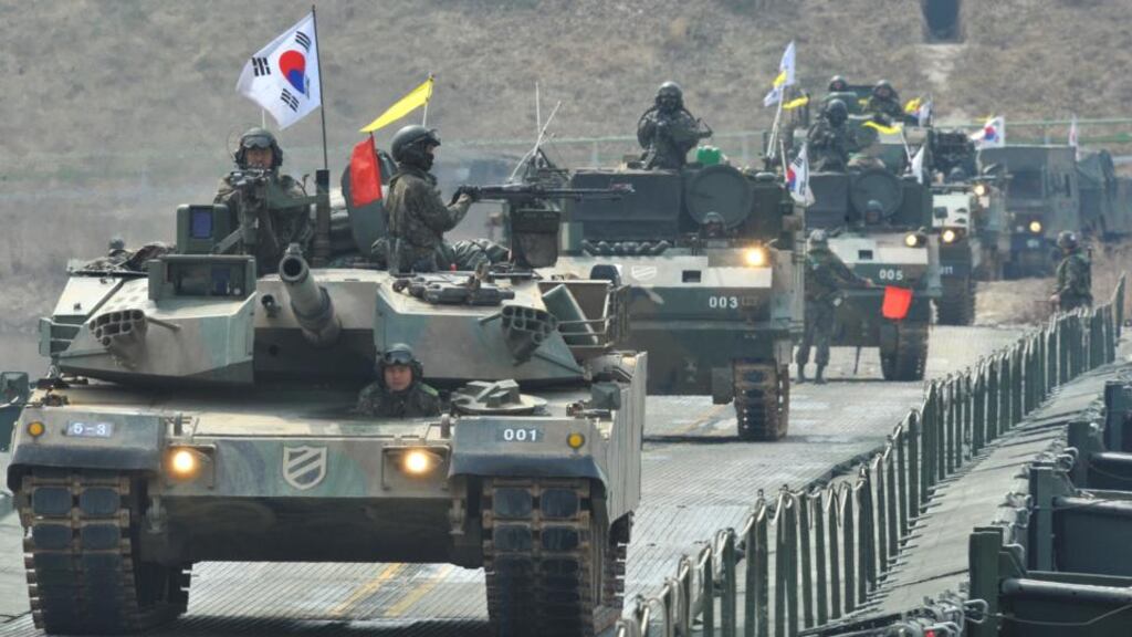 South Korean tanks move over a temporary bridge during a river-crossing military drill in Hwacheon near the border with North Korea yesterday. Photograph: Kim Jae-Hwan/AFP/Getty Images